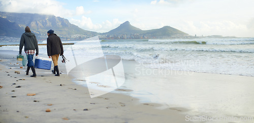 Image of Fishermen, equipment or walking on beach for fishing on cloudy morning or afternoon in Cape Town. Friends, men or male tourists with net, pole and cooler box by sea, shore or coast for mockup