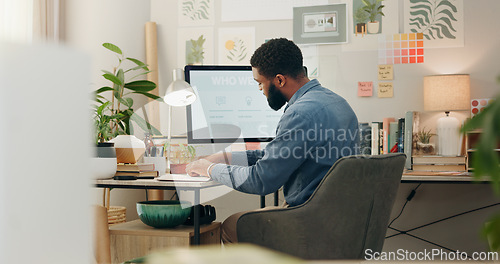 Image of Night, desk and a black man with a notebook for planning of work goals, target or ideas for a project. Workspace, strategy and an African businessman writing for deadline inspiration or notes