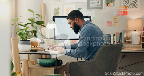 Image of Night, desk and a black man with a notebook for planning of work goals, target or ideas for a project. Workspace, strategy and an African businessman writing for deadline inspiration or notes