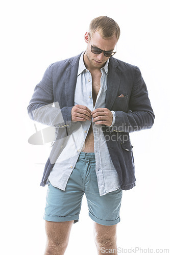 Image of Fashion, button and man in studio with clothes, trendy blazer, stylish outfit for a col aesthetic. Wearing, confidence or male model with a fancy style or edgy sunglasses isolated on white background