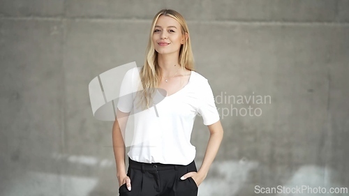 Image of Confident Woman in Casual White T-Shirt Posing