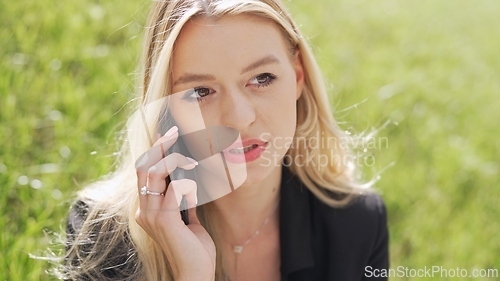 Image of Young Woman Holding Blank Board in Sunny Field