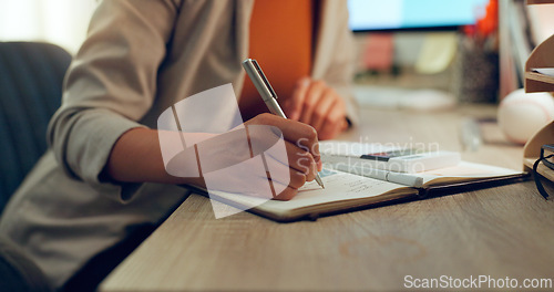 Image of Accounting, hand and calculator or writing in a notebook for finance budget, cost or tax math. Closeup of an accountant woman at desk with notes for calculation, bookkeeping or investment in business