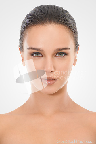 Image of Woman, skincare and face in studio for beauty with natural look, cosmetics and dermatology for wellness. Girl, portrait and clean for self care, mockup and white background with serious model