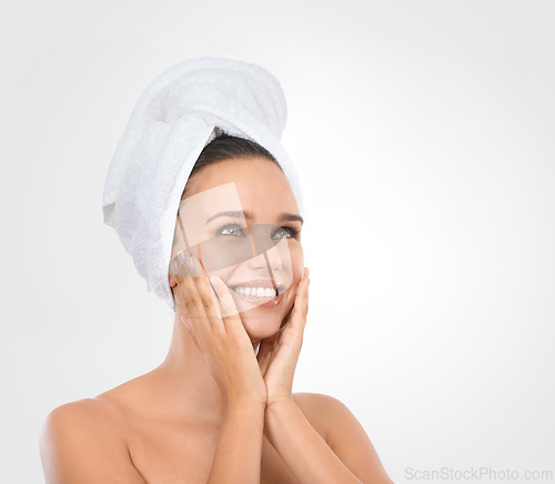 Image of Portrait, woman and hands for moisturizing skincare with smile, head towel and white background. Mockup of female person, glow and natural makeup for self care, spa treatment and flawless skin