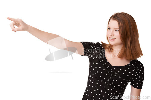 Image of White background, portrait and girl to point, wonder and contemplate with mockup in studio. Confident, gen z teenager or female student with finger, eyes and smile to imagine, announce and show ideas