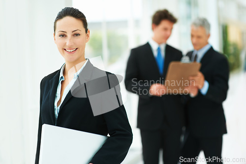 Image of Professional, woman and portrait in company with laptop and team in lobby of London office. Happy, person and business people in workplace with report, checklist and collaboration on project