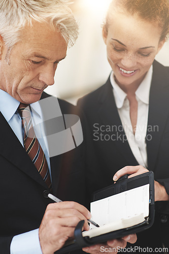 Image of Leader, showing and notebook to worker in workplace for business in corporate company for strategy. Woman, smile and talking to boss in office, happy and professional in clothes for work or job