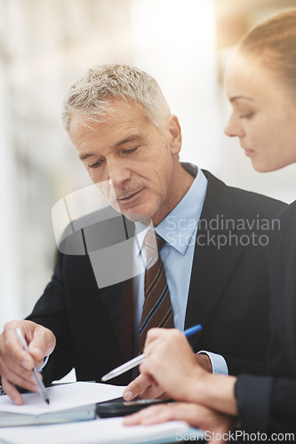 Image of Boss, planning and talking to employee in office for strategy with notebook and brainstorming. Woman, conversation and collaboration with CEO of corporate company for business with discussion