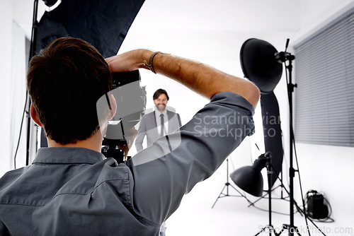 Image of Back, model and photographer in studio, gear and pose with confidence and professional with equipment. Employee, freelancer and entrepreneur with lighting and campaign with style, tools and portfolio