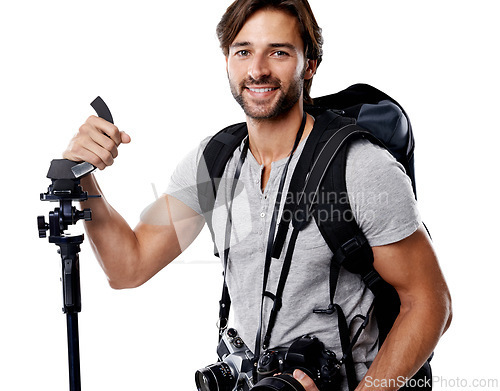 Image of Portrait, man and backpack with photography equipment for photoshoot in studio on white background. Professional photographer, confidence and bag with cameras, tripod and big smile for mockup
