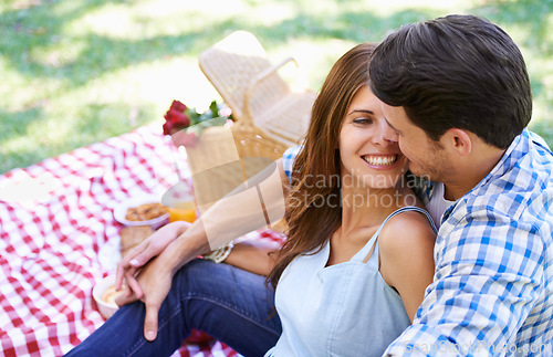 Image of Love, picnic and roses in basket with couple for Valentines Day for celebration, anniversary and relax on vacation. Happy, food and travel with romantic partners, park date for holiday summer