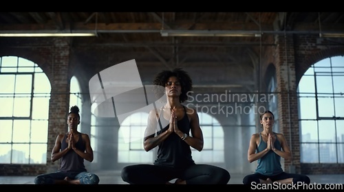 Image of Group of People Practicing Yoga in a Spacious Urban Loft