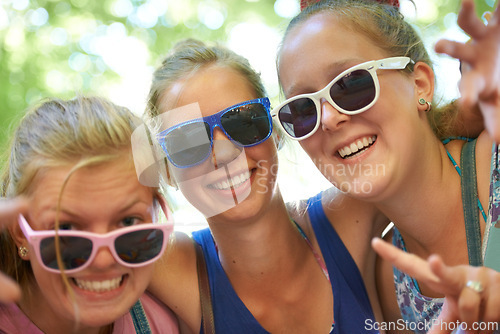 Image of Sunglasses, friends and portrait of women in nature on holiday, vacation and weekend outdoors. Happy, fashion and people with trendy style for bonding, fun and relax on adventure, travel and trip