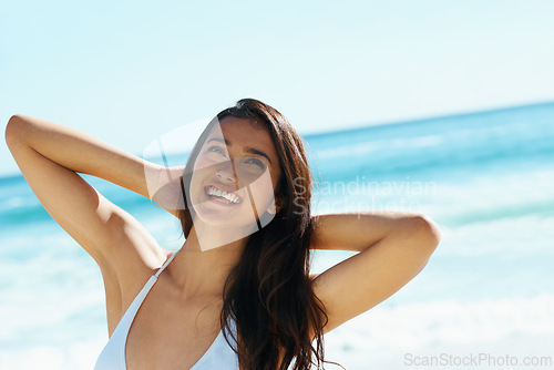 Image of Woman, ocean and thinking in bikini with smile, outdoor and relax on holiday in summer with nature. Girl, person and happy with ideas, vision and adventure by tropical vacation with waves in Naples