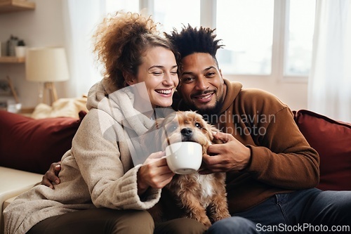 Image of Happy Couple Relaxing on the Sofa with Their Pet Dog