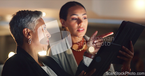 Image of Mentor, training and employee working on a night project with manager helping with computer or online strategy. Corporate, talking and business women planning together for company development