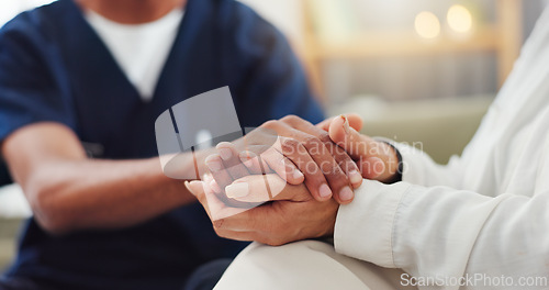 Image of Empathy, closeup and nurse holding hands with woman for consulting with kindness, comfort or support. Sorry, understanding and health specialist with patient in consultation room, solidarity or hope