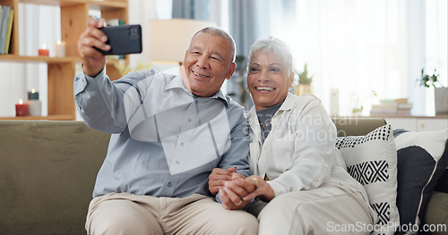 Image of Senior couple, selfie and sofa with love, social media and happy together in a home. Retirement, marriage and profile picture with elderly people in a house on a website online with support and trust