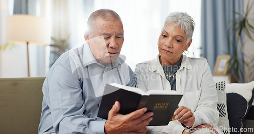 Image of Senior, couple and home reading bible and talking of faith, god or helping with spiritual guide of scripture on sofa. Elderly man, pastor and christian woman with holy book for religion and support
