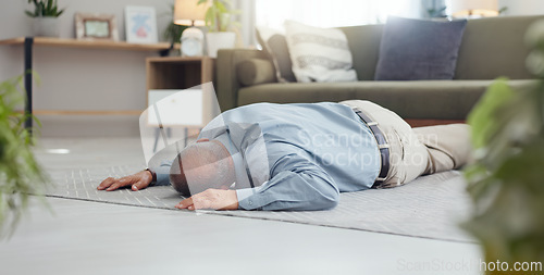 Image of Man, faint and accident on home floor with heart attack, cardiac arrest or unconscious in living room. Mature person on ground and alone with medical risk, emergency and healthcare problem or death