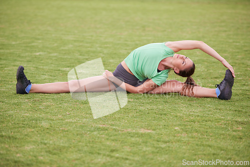 Image of Balance, stretching and woman on field for exercise, workout and training for running outdoors. Sports, fitness and person warm up for wellness, healthy body and flexibility for performance on grass