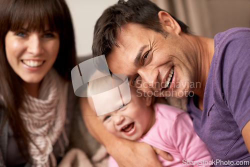 Image of selfie, love and baby with parents in a house for bonding hug, support or having fun together. Happy family, portrait or people embrace excited kid for profile picture memory or playing in their home