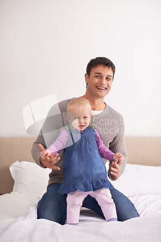 Image of Portrait, love or father and baby on a bed happy, playing or bonding at home with morning games. Child development, learning and face of dad with girl in a bedroom for fun, support and family time