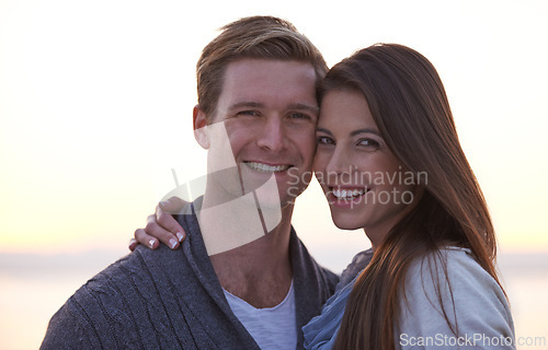 Image of Love, hug and portrait of couple at ocean at sunset for tropical holiday adventure, relax and bonding together. Evening, happy man and woman on romantic date with beach, sky and embrace on vacation.