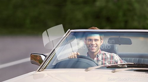 Image of Happy man, portrait and driving car for road trip, travel or adventure on outdoor adventure. Young male person with smile in vehicle for transportation, holiday getaway or drive on street in nature
