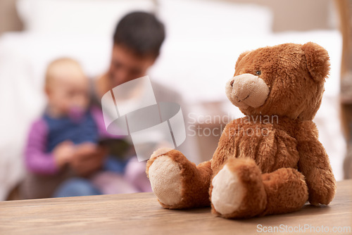 Image of Love, reading or father and baby with book in a bedroom for reading, bonding or playing with teddy bear blur. Family, learning and dad teaching kid with storytelling, fantasy or security in a house