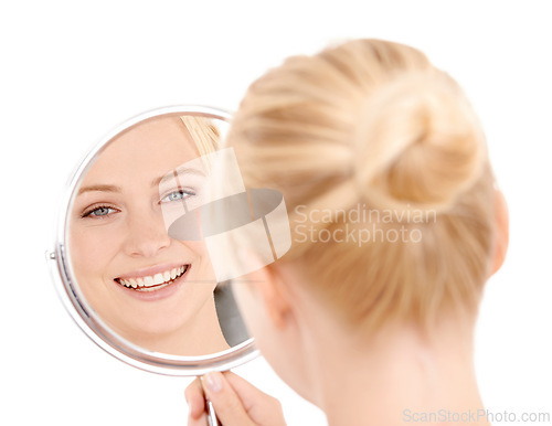 Image of Reflection, face and woman with beauty, natural glow and smile with dermatology isolated on white background. Clean, skincare and vanity with admiring skin in mirror, wellness and cosmetic care