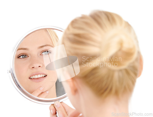 Image of Face, reflection and woman with beauty for natural skincare and wellness on white background. Mirror, vanity and admiring clean skin with healthy glow, facial treatment and hygiene with smile