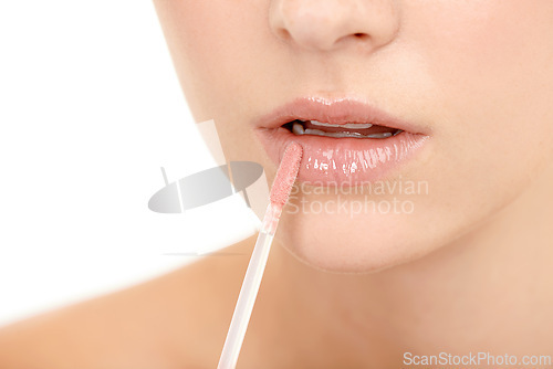 Image of Lips, lipstick application and beauty with woman and closeup of cosmetic product on white background. Skin, glow and matte gloss with brush, lipcare for wellness and hydration with makeup for shine