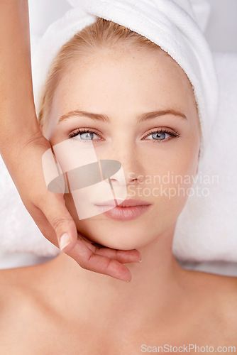 Image of Facial, massage and top view of woman with hands of masseuse, beauty and wellness with spa treatment. Skincare, face pamper cosmetics and antiaging self care with dermatology for glow in portrait