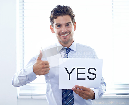 Image of Businessman, portrait and happy with poster or thumbs up for yes, we are hiring and recruitment support in office. Human resource, employee and face with smile, billboard paper and placard with offer