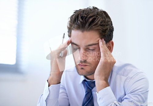 Image of Headache, stress and business man with burnout, pain and anxiety for overwork in office. Migraine, depression and professional massage temples for fatigue, sick and tired agent frustrated in company