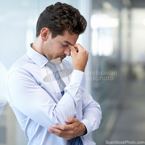 Image of Headache, fatigue and business man with stress, burnout and anxiety for financial crisis in office. Frustrated, depression and serious professional with pain, sick and fail challenge with mistake