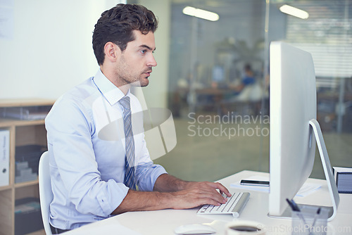 Image of Business, accountant and man with a computer, typing and internet with research and online reading. Person, employee and financial adviser with a pc and connection with company website and technology