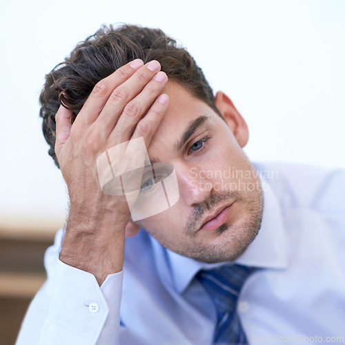 Image of Headache, stress and business man with burnout, tired or anxiety for financial crisis in office. Frustrated, depression and serious professional with fatigue, thinking or fail with regret for mistake