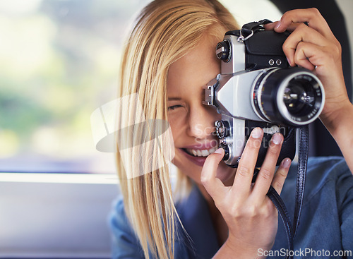 Image of Camera, photography and woman on road trip with journey, travel and creative hobby or photoshoot. Young freelancer, traveler or photographer shooting in car for digital memory, vacation and holiday