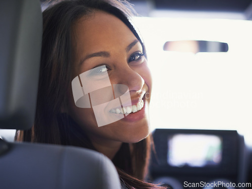 Image of Woman, portrait and driving in car for road trip, travel and happy on journey with transportation. Face of a young person or driver with smile in a modern vehicle and ready for adventure or holiday