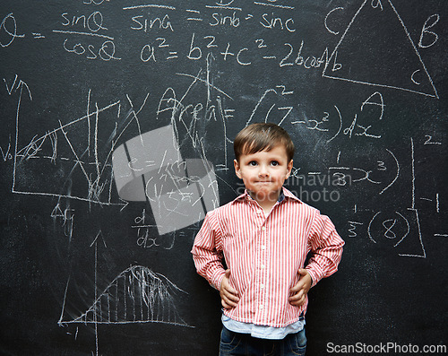 Image of Smart, child and math on chalkboard for school, learning and education with ideas, thinking or confidence. Genius and clever kid, boy or student with equation, numbers and test for IQ or intelligence