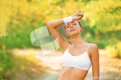 Image of Fitness, sweat and tired woman in a park with running break from intense morning cardio outdoor. Sports fatigue, burnout and female runner in a forest with low energy after marathon, training or run