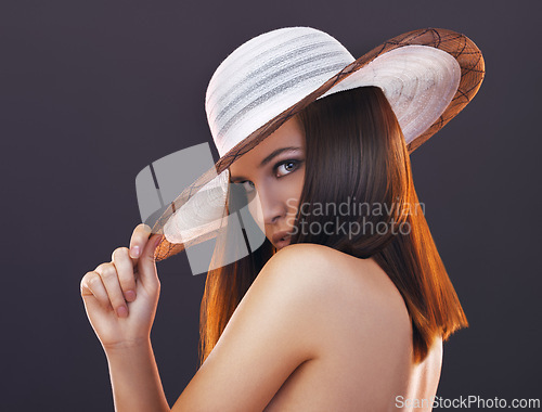 Image of Portrait, hat and fashion with woman, beauty and person on a grey studio background. Face, model and girl with stylish clothes and confidence with mock up space and elegant with summer accessory