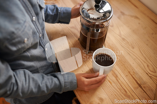 Image of Hands, coffee plunger and barista in cafe, process and professional service in small business. Closeup, ground and waiter prepare espresso drink, port a filter or cappuccino beverage in shop