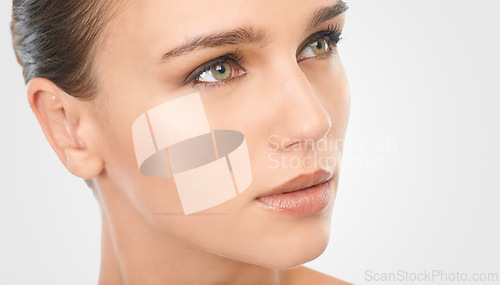 Image of Woman, natural makeup and glow with vision for beauty, skincare and cosmetology in studio closeup. Female person, thinking or planning for flawless skin and moisturizing treatment on white background