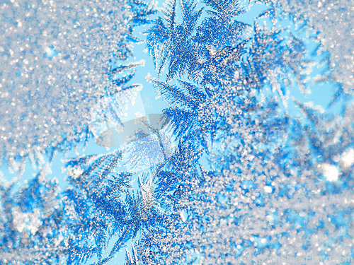 Image of Ice, macro and snow crystal on glass with winter abstract pattern and beauty in nature. Frost, background or wallpaper with closeup on frozen weather, texture outdoor or detail from snowstorm