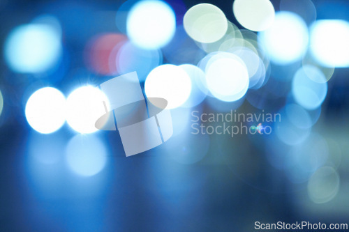 Image of Bright lights, abstract and night with pattern, city and graphic against a blue background. Creativity, bokeh and blur with aesthetic and shining with colours and effect with circles and glowing