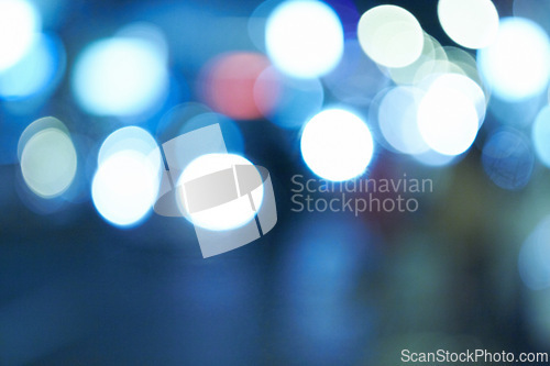 Image of Bright lights, abstract and night with design, city and graphic against a blue background. Creativity, bokeh and blur with aesthetic and shine with colours and effect with pattern, texture and glow